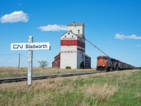 CN 548 passes the elevator at Bladworth Saskatchewan with a train of MGLX empties to interchange with Last Mountain Railway at Davidson. 