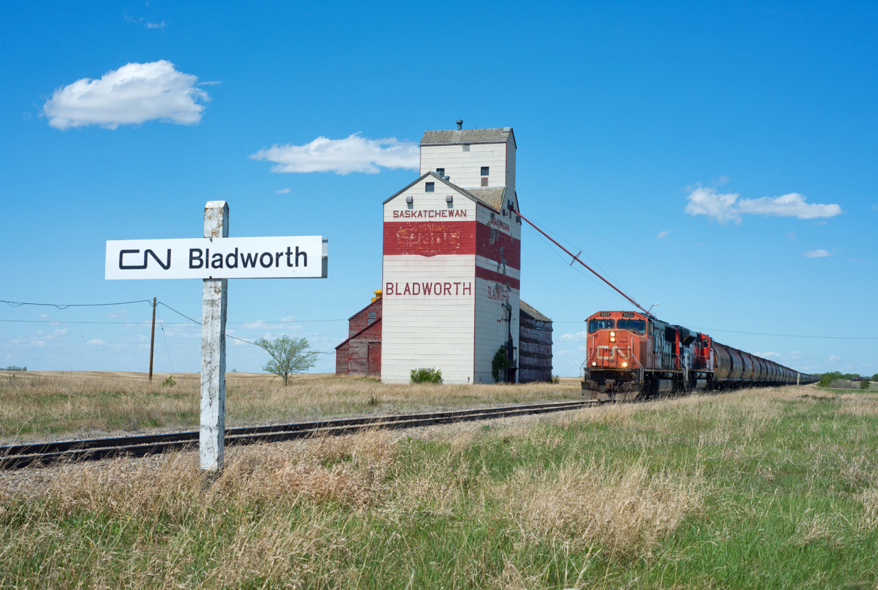 CN 548 passes the elevator at Bladworth Saskatchewan with a train of MGLX empties to interchange with Last Mountain Railway at Davidson.