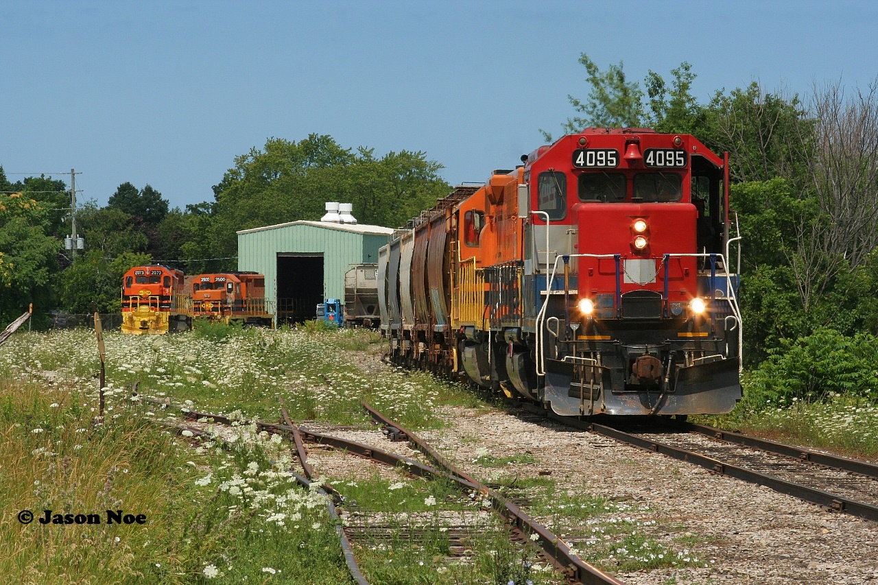 Goderich-Exeter Railway 581 pauses at Goderich, Ontario while the crew finishes their lunch, after lifting salt hoppers from the harbor. Shortly 581 would begin the trip back to Stratford on the Goderich Subdivision with RLK GP40 4095 leading the short train. 

Less than a year later, this former CN unit has since been repaired and returned to service following extensive repairs to damage it had received in a runaway derailment in Goderich during February 2021.
