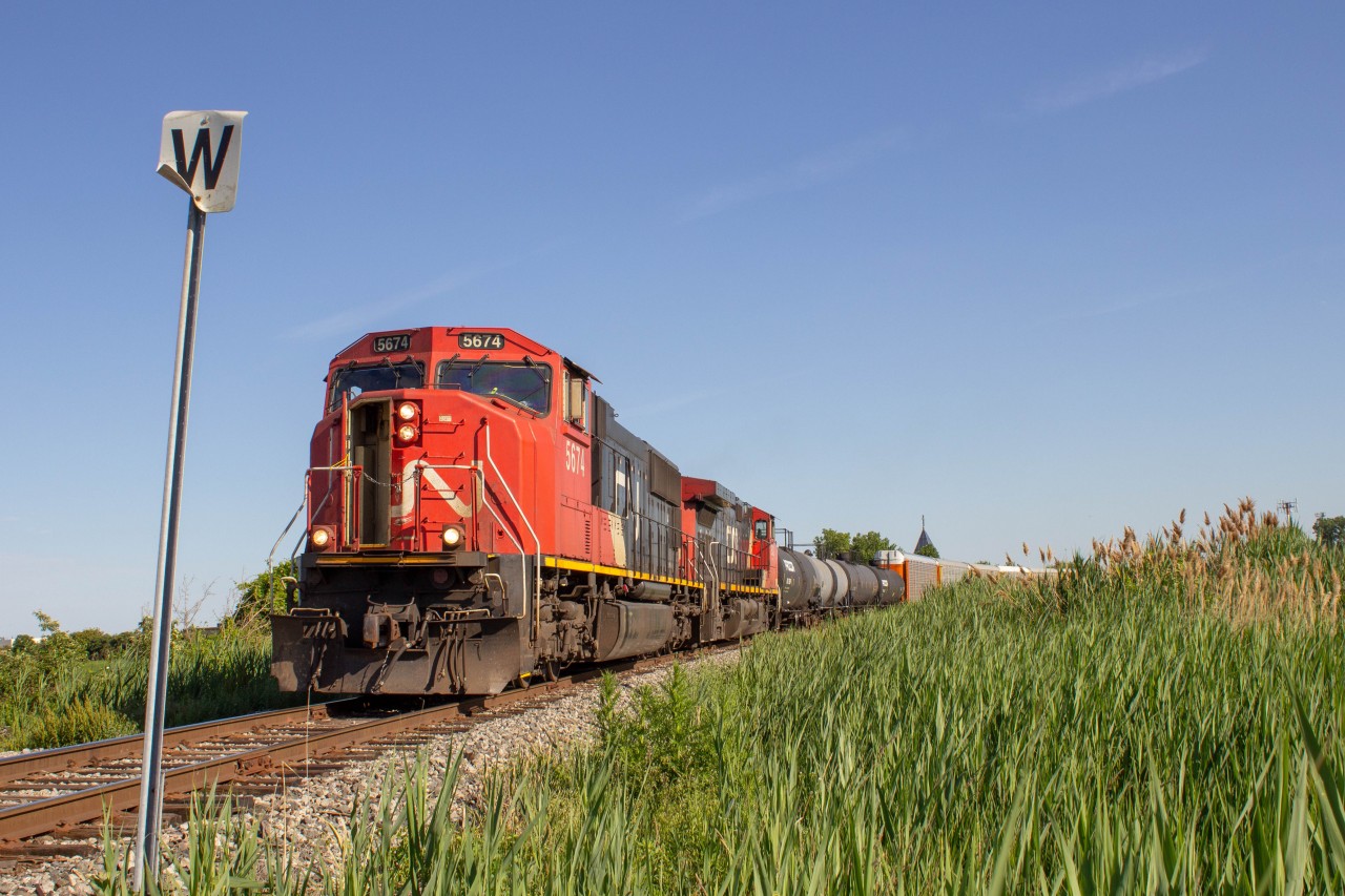 Cn 438 rolled down the Cn Pelton Spur, again giving the crew a natural cooling session with the cab door open.