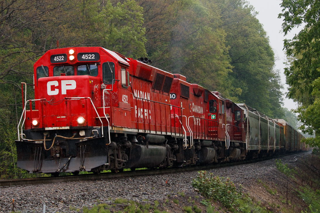 CP T72 heads west with 4522 leading the way. The trio sure sounded awesome crawling up Orr's Lake.