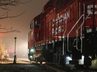 A light cold drizzle has been falling for hours as CP local T14 prepares for the trip back to West Toronto after spending most of the night working Streetsville. The crew has just turned off the interior lights and illuminated the Dutch lights as the signal in the distance changes to allow them to proceed home. While dreary weather like this doesn't make for great daytime photos, at night it really helps make the scene come Alive. Typically a day job, back in early 2017 a track work project in Obico forced the local into the night time hours for a few weeks. It was a nice change allowing for a few night photo opportunities. 