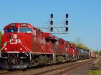 CP 234 has just entered the plant at the west end of Erindale. The leader is a clean looking rebuild, and a pair of former SOO SD60's are trailing. The signal bridge here was moved back when new LED signals were installed a few years ago, and a trail leads right up to the tracks.
