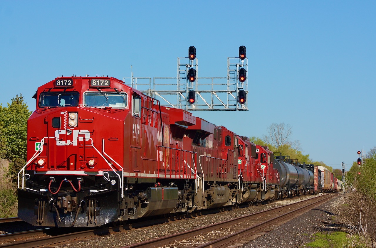 CP 234 has just entered the plant at the west end of Erindale. The leader is a clean looking rebuild, and a pair of former SOO SD60's are trailing. The signal bridge here was moved back when new LED signals were installed a few years ago, and a trail leads right up to the tracks.