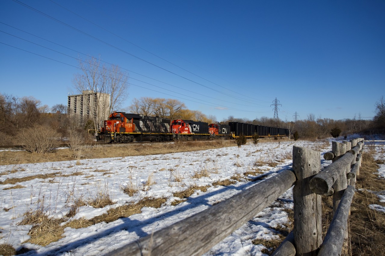 CN L583 passes the nature reserve and trail at Glen Cairn Park in London on their way to London East Yard. The frames came from Formet in St Thomas, and are destined for assembly plants in the US.