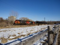 CN L583 passes the nature reserve and trail at Glen Cairn Park in London on their way to London East Yard. The frames came from Formet in St Thomas, and are destined for assembly plants in the US. 