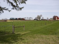 CN A439 races through the farmland of Komoka on the outskirts of London. With CN rapidly retiring their aging fleet of Dash 8s, these "Blue Devil" units are not long for this world, at least under CN ownership. 