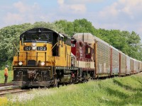 Not all that many years ago CP and CN had to work together on the same rails to serve the busy GM/Cami facility in Ingersol. Fast forward to today and OSR handles all the traffic, interchanging with CP in Woodstock and CN at East Ingersol. OSR's newest kid on the block, former Essex Terminal GP9 102 (reportedly the last GP9 built) works with former CP GP9U 1620 as they arrive at the wye to Cami after picking up a string of auto racks from CN at Ingersol's east end. A crew member is on the ground ready to cut off the power and briefly head to Putnum before returning to Cami, to lift a lone auto rack destined for the CP interchange in Woodstock. 