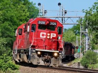 Sometimes when you get lucky, you still get screwed, with only seconds to spare I attempted to beat this power move to the field by the elevator in Streetsville. I guess you can tell who won the race, LOL. Nevertheless it was quite the power move with GP38-3 3129 leading a pair of ex SOO SD60's along with a BNSF, UP and CP ES44AC plus well weathered CPGP38AC 3018 bringing up the rear. I love the angle of the tracks at the Mississauga Road crossing.
