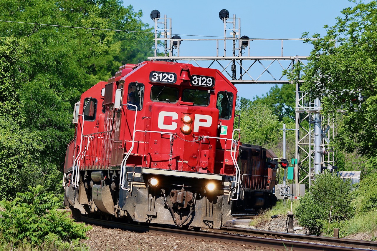 Sometimes when you get lucky, you still get screwed, with only seconds to spare I attempted to beat this power move to the field by the elevator in Streetsville. I guess you can tell who won the race, LOL. Nevertheless it was quite the power move with GP38-3 3129 leading a pair of ex SOO SD60's along with a BNSF, UP and CP ES44AC plus well weathered CPGP38AC 3018 bringing up the rear. I love the angle of the tracks at the Mississauga Road crossing.