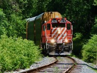  Summer heat waves are very apparent as OSR's Woodstock job returns back to Ingersol after a run to the CP interchange. The crew have brought their train to a stop just before the connecting track to CN as they wait for two of OSR's "pups" SW1200's to return with a cut of cars. From here both jobs will head over to the large CAMI plant on the west side of town to work loaded and empty auto racks before ending their days.