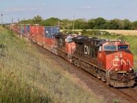 CN train 147 storms west under late day light after passing the empty sidings at Paris West. This is one of those spots I have not spent much time at over the years but was definitely worth walking the field for a bit of a different angle. 