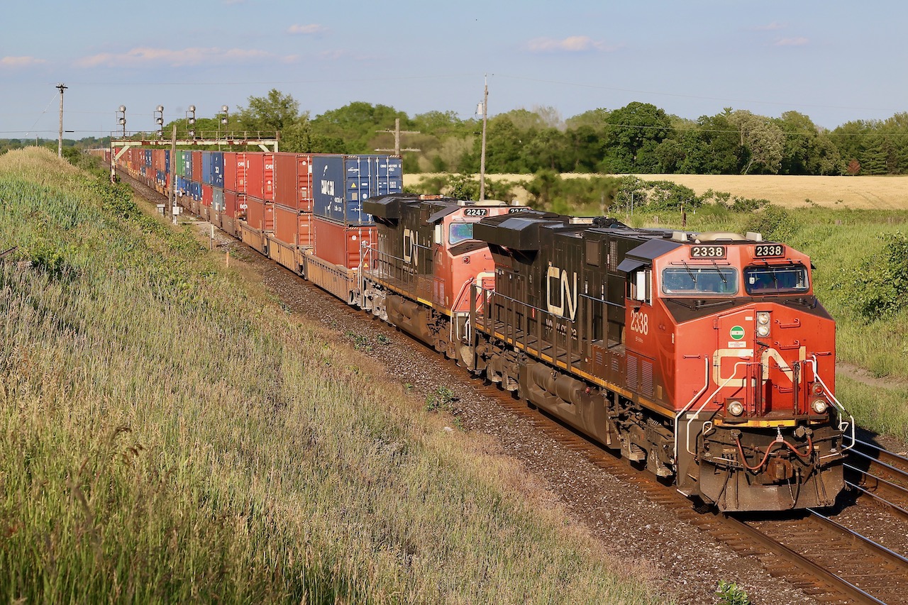 CN train 147 storms west under late day light after passing the empty sidings at Paris West. This is one of those spots I have not spent much time at over the years but was definitely worth walking the field for a bit of a different angle.