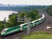 This is a relatively new vantage point in Hamilton, unfortunately sunny days do not work too well for this angle, so Saturday's dreary weather worked out well for this shot. This was a somewhat interesting GO train, being that it was the first of the summer Niagara Falls trains complete with bicycle equipped passenger cars. The windows of the cars for this service have bicycle images on them. The train is working its way through Hamilton junction, with the "cow path" and CP's Hamilton subdivision entering to the right and the Hamilton subdivision departing in the distance under the high level bridge.