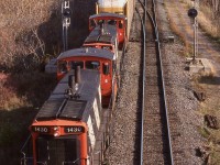 For most of us in Ontario in the early 2000's CN's GMD1'S were a rarity, while some of the units have spent some time over their careers in eastern Canada most were prairie wanderers, roaming the network of grain branchlines in the Canadian prairies. The arrival of these two re-trucked and renumbered GMD1'S sent me on a search from Mississauga to Sarnia only to end up empty-handed. Luckily with time I was able to track the pair down. Both 1600 and 1601 spent the last year of their western lives lifting rail on the abandoned lightweight branchlines before trading trucks and being renumbered 1430 and 1431. Here the pair have given up hauling old 40' boxcars and hoppers of grain for a long cut of autoracks full of Ford vehicles. They are seen working the west end of Aldershot after traveling from Oakville yard, with fading autumn colours all around.
