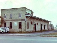 The L&PS RY was long gone when I took this picture of the old L&PS freight shed in London Ont.. I guess I took it to keep my child hood memory banks alive. With great enjoyment I Watched the Electric motors & Electric passenger cars moving freight around the area. I did this as a kid in the late 1940's & early 1950's and it was always a pleasurable occurrence. On the north side of the building there was a line that connected the L&PS and the CNR lines. I was standing on the east side of Colborne St. when I took the picture. If I had taken a similar picture in the early 1950's I could have turned 180 degrees and photographed the old L&PS roundhouse. I often wonder what life in London would be like today if the population had the chance to hop on an electric car and ride down to the beach in Port Stanley? As a side note at one time London had 5 roundhouse's & 2 car barns, & a street car barn. 