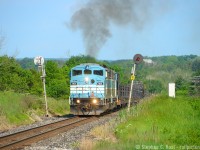 Between Bolton and Palgrave on the CPR Mactier subdivision lies this neat set of bidirectional signals that I've photographed a <a href=http://www.railpictures.ca/?attachment_id=32902 target=_blank>few times.</a>. Normally, an extreme telephoto does well here, but when those SD40-2F's started climbing the grade, they let out quite a bit of smoke for an EMD meaning I had to zoom out a bit. A nice show for a work train - which by the way had work to do in Toronto.