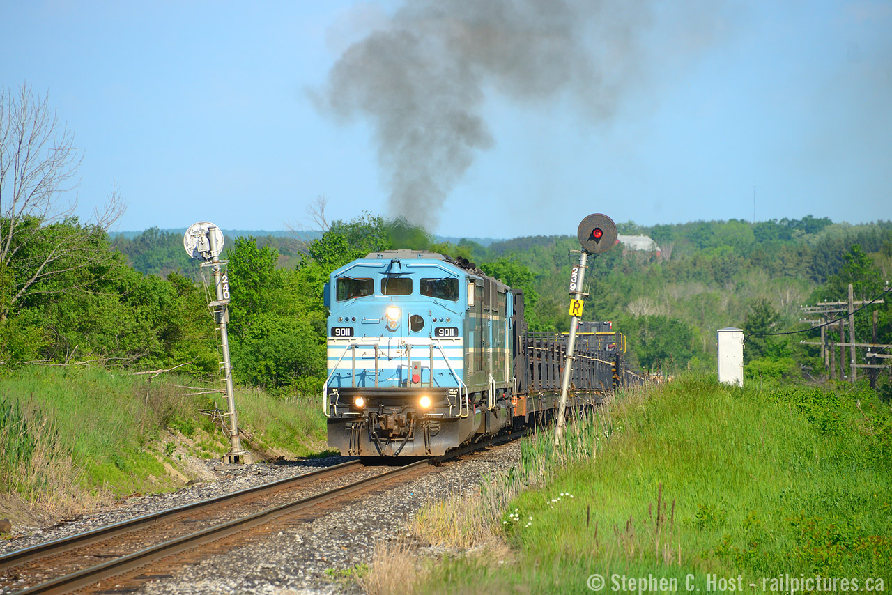 Between Bolton and Palgrave on the CPR Mactier subdivision lies this neat set of bidirectional signals that I've photographed a few times.. Normally, an extreme telephoto does well here, but when those SD40-2F's started climbing the grade, they let out quite a bit of smoke for an EMD meaning I had to zoom out a bit. A nice show for a work train - which by the way had work to do in Toronto.
