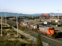 Northbound empties bound for the iron ore mines of western Labrador, departs the yard at the St.Laurent harbour of Sept Iles