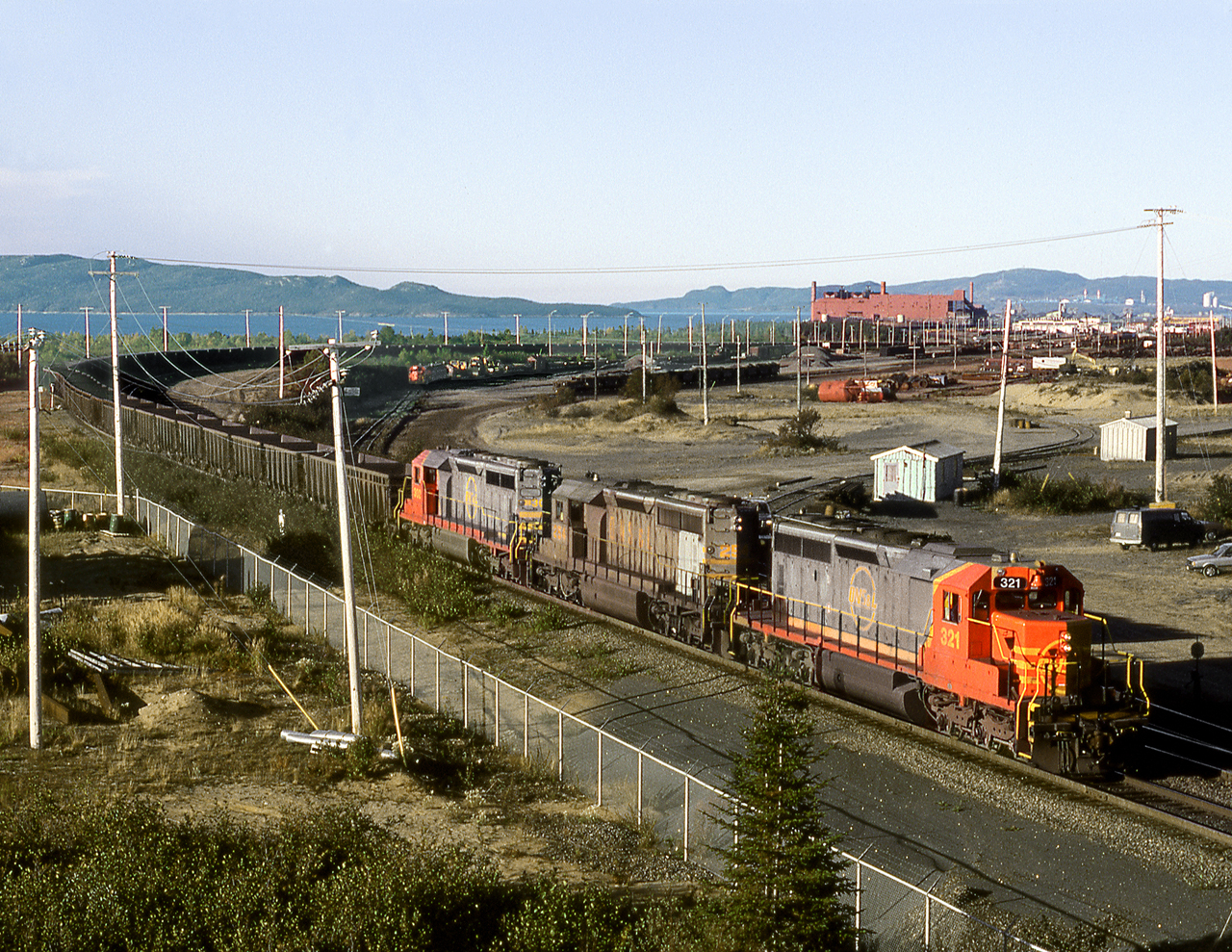 Northbound empties bound for the iron ore mines of western Labrador, departs the yard at the St.Laurent harbour of Sept Iles