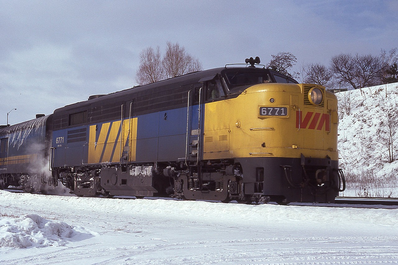 I've always been a big fan of these old F units.  Bayview Junction was a great place to grab a good shot of any that passed thru, with the low speed restrictions as well as many trains being held at signal to the Oakville sub.  This is such an example. Having 6771 stop made for a great photo opportunity. The earliest paint scheme for VIA featured a few variations of the style of a yellow nose and the CN noodle applied in red. That was short lived, replaced by a red (or a rare blue) VIA as seen here. Only a couple of years went by and the scheme reverted to a plain yellow nose.