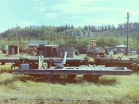 When I first spotted this interesting little WP&Y car it was surrounded by grass and sitting on the rails behind the locomotive shed in city of Whitehorse YT. Having grown up in southern Ontario and living out west I have seen lots of section cars but none as large as this, so I did a little research and came up with an answer that could be totally incorrect! In the early 19th century there was a company in Harvey Illinois called the Buda Co. that built section motor cars. In Dawson City Yukon the museum has the body of a Buda car with no wheels. That puts a Buda car in Yukon at the time period of the KMR, and the KMR did buy equipment from the WP&Y so maybe the car in the picture was also made by the Buda Co. It does not look home made. Having said that it does have a nice drivers seat. Does it still exist, that I can't answer. All the buildings in the background were occupied by squatters who have since left the area.