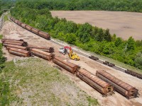 While in the Niagara area yesterday I came across a sad yet interesting scene.  10 ex Canada Wheat Board hoppers lying on their sides awaiting the scrappers torch while a string of 9 more wait nearby.  There is also another large cut off in the distance.  These cars were built in 1979/1980 and with CN and CP taking delivery of new hoppers over the last few years these grain cars were on borrowed time.  It is sad to see them go.