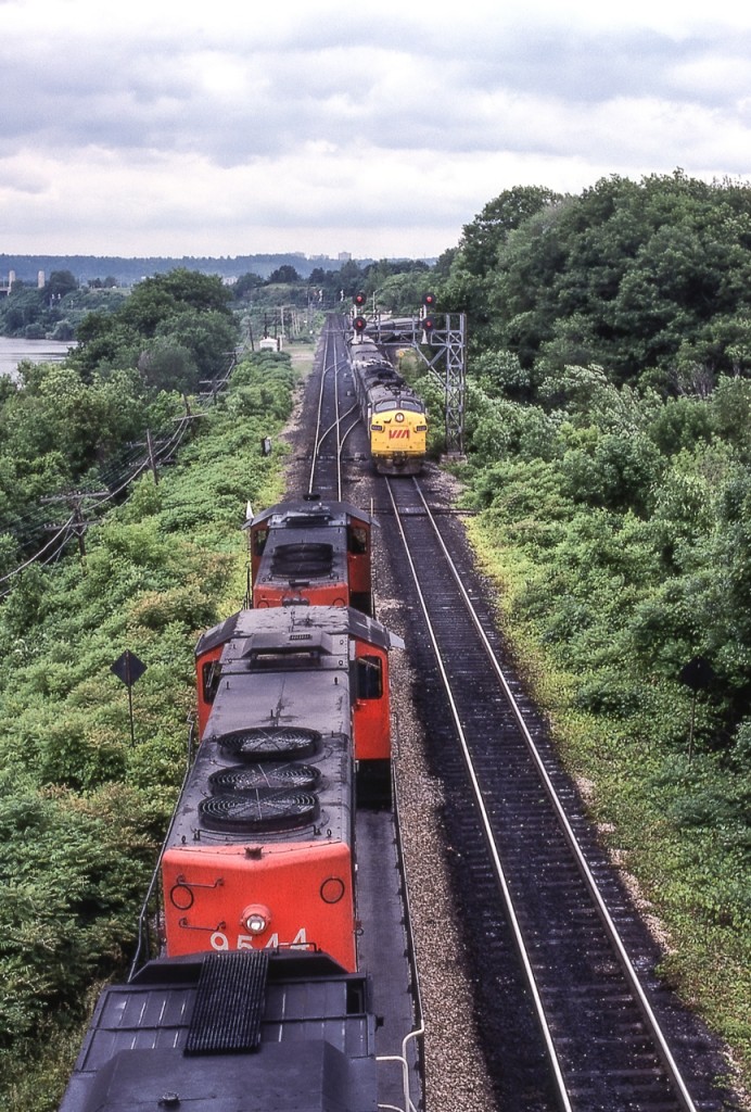 Eastbound VIA 6530 meets a CN freight at Bayview Junction, Ontario in July 1980.