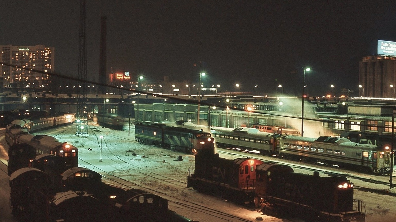 ...something for everyone....at the roundhouse....for fans of:  Budd Car 's ; MLW S-2 's ; FPA-4 's  ;  MLW RS-18m ; GP40  ….


   ...typical winter evening, after the camera equipment acclimatized …..


   ….and no battery required …..do  s l o w l y  advance the film ! 


   At CN Spadina, January 2, 1977 Ektachrome by S.Danko