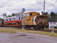 <br>
<br>
   CP Rail SD-40-2 trio  5904  5788  5673 is the power for a southbound at  Bala, 
<br>
<br>
   The transit vehicle is the new MBTA 01741, one of 58 built by UTDC Thunder Bay 1987-1989 (all rebuilt 2010-2016),
<br>
<br>
   The Red Line roll sign is set for 'Park Street'
<br>
<br>
   CP road van 434369 carries the markers
<br>
<br>
   At mile 114.7 Mactier Sub on a steamy July 1, 1988, Kodachrome by S.Danko 
<br>
<br>

