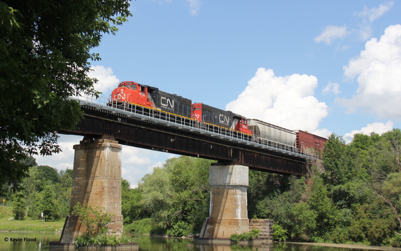 CN L540 is pictured crossing the Grand River at the east end of Kitchener with CN 4796-4705 for power. I wasn't planning on shooting any trains, but a family walk at Kolb Park on Canada Day was in order. So, bringing my camera was a must. This is literally the first train I shot on the Guelph Sub since my brief return to Kitchener after living in the Hamilton area for almost two years. The 4796-4705 duo has been in the area for quite some time now.