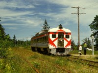 At Courtenay, the north end of CP’s Dayliner passenger service on Vancouver Island, a wye was used to turn the car to always have the baggage compartment leading, but in the Spring of 1972 that wye was removed, so changing ends became normal practice, with the result seen here on Friday 1973-06-02 as E&N southbound train No. 2 with Budd/CC&F RDC2 CP 9199 eases to a flagstop at Union Bay at mileage 130.2 of the Victoria subdivision, baggage compartment trailing but precisely on time at 1213 PDT.
