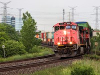 CN Z149 rounds the bend at mile 15 of the York sub with a pair of veteran Canadian Cab Dash 9s. Built in 1994, the C44-9WL was installed with CNs unique "Canadian Comfort Cab"; a design that made engines both safer and more comfortable. 23 were made for CN and 4 were made for BC Rail. Seeing a pair of Canadian Cab Dash 9s has always been pretty uncommon, let alone in 2021 while CN has dozens of locomotives in storage.