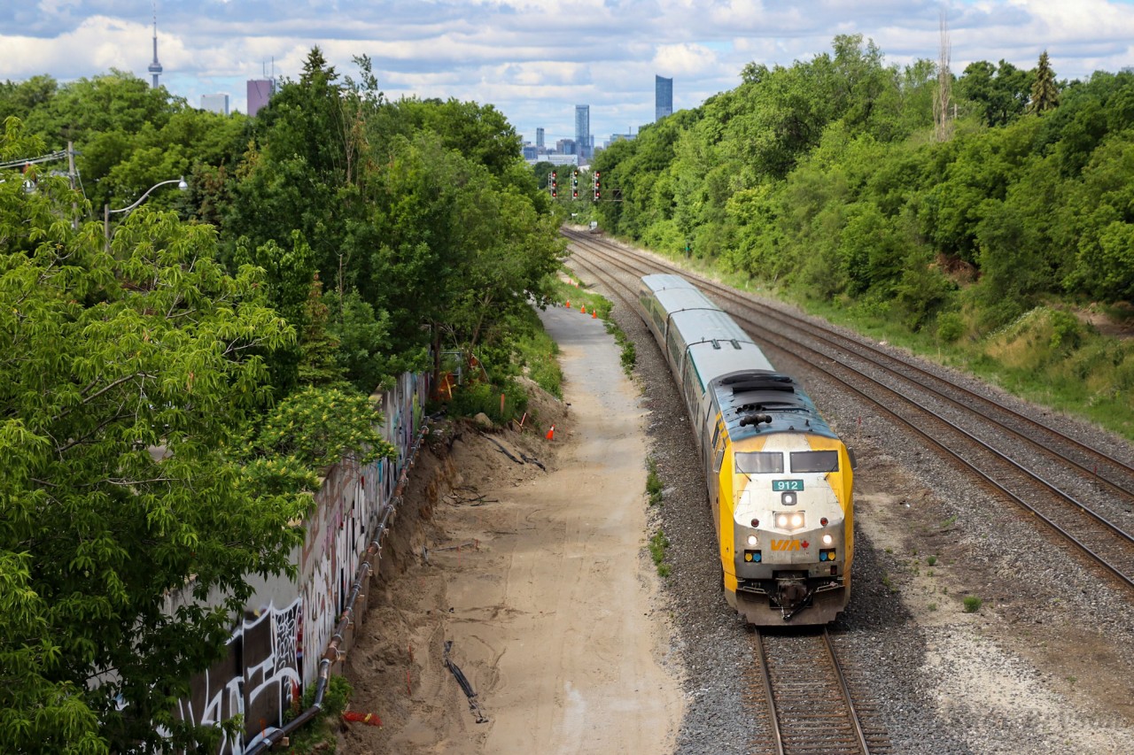 VIA 40 flies through Danforth GO with VIA P42DC 912 and 4 LRC coaches. VIAs P42DC fleet is approaching 20 years of age and with their replacement (Siemens Chargers) being built in California, I figure now is as good a time as any to shoot them in sunlight.