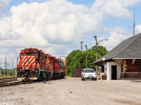 OSR 1591 and OSR 8235 (both Ex CP GP9Us) sit beside the historic Woodstock CP station as they wait for 2 cars from CP T69. At the same time, the OSR car pulls up to the station as the full crew heads into the station building. The OSR car always has a crew member and it follows the train along, dropping the crew member off in various places to throw a switch, uncouple a car, and more. This eliminates the necessary walk along the train to get back to the engines. This was the start of a chase that I partook in so hopefully more photos of this fantastic duo will appear soon!