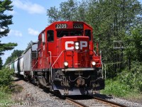 With nine cars in tow CPR 2209 returns to Newport, Vermont from Farnham, Quebec.