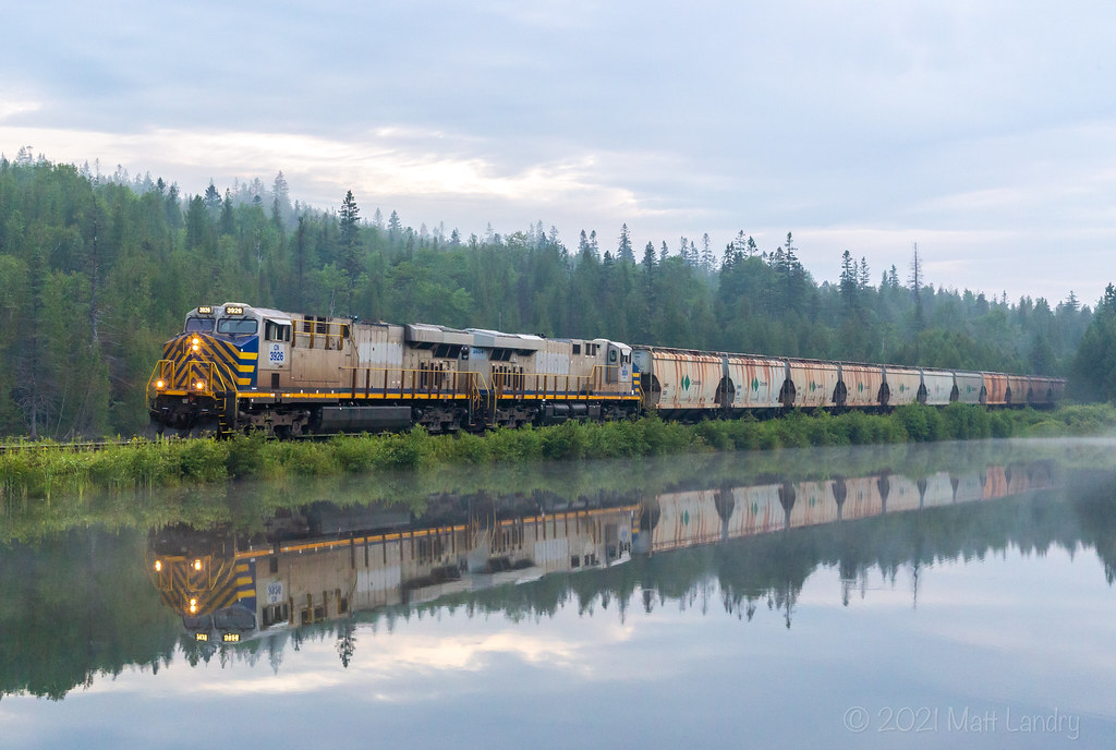 A pair of ex CREX ponies power 730 as they head by the "unnamed lake", approaching Saint John, New Brunswick, their final destination.