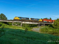 214 makes its way Southbound across one of the Wabi River bridges with back-to-back SD75I's (2102 & 2103).
<br><br>
Near Mile 115.5 Temagami Sub - July 10