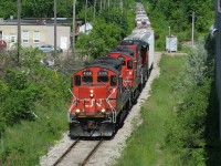 CN L540 has just crossed Madison Avenue in Kitchener as it heads to the interchange with Canadian Pacific on the Huron Park Spur in Kitchener. The consist included; CN 4136, 7083 and 4790. 