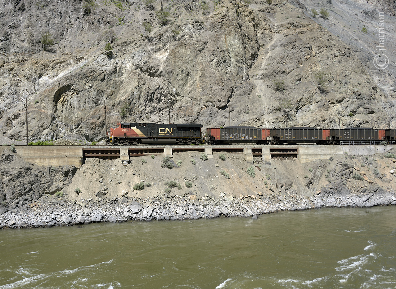 Unlike today, the air was fresh and crystal clear as westbound CN 2800, with a loaded coal train, traveled along the Thompson River near, or at Morris, on CNs Ashcroft Sub. The location is about halfway between Lytton and Spences Bridge, and just across the river from CPs mile 84.71 Nicomen Overpass.
