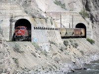 Westbound CP 8150, and trailing in the shed, 8153, at the Skoona Tunnels, Spences Bridge. This little creature appeared within two weeks of my last visit here. The psychology behind graffiti can be easily found online and my attitude regarding the defacing of monumental engineering feats should be taken for granted so, I'll just stick to the logistics. The following shot will show how this is possible.    