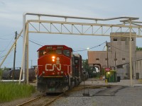 CN 536 with CN 9411 & CN 4802 is lifting acid empties at the Canadian Electrolytic Zinc (CEZ) plant in Valleyfield just before sunset.