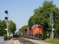 CN 120 has a trio of GEVO's (CN 2993, CN 3256 & CN 3204) and a 614-axle long train as it passes a pair of searchlight signals located at MP 70.3 of CN's St-Hyacinthe Sub. Interestingly enough these signals are only a few years old and replaced a signal bridge that had older searchlight signals.
