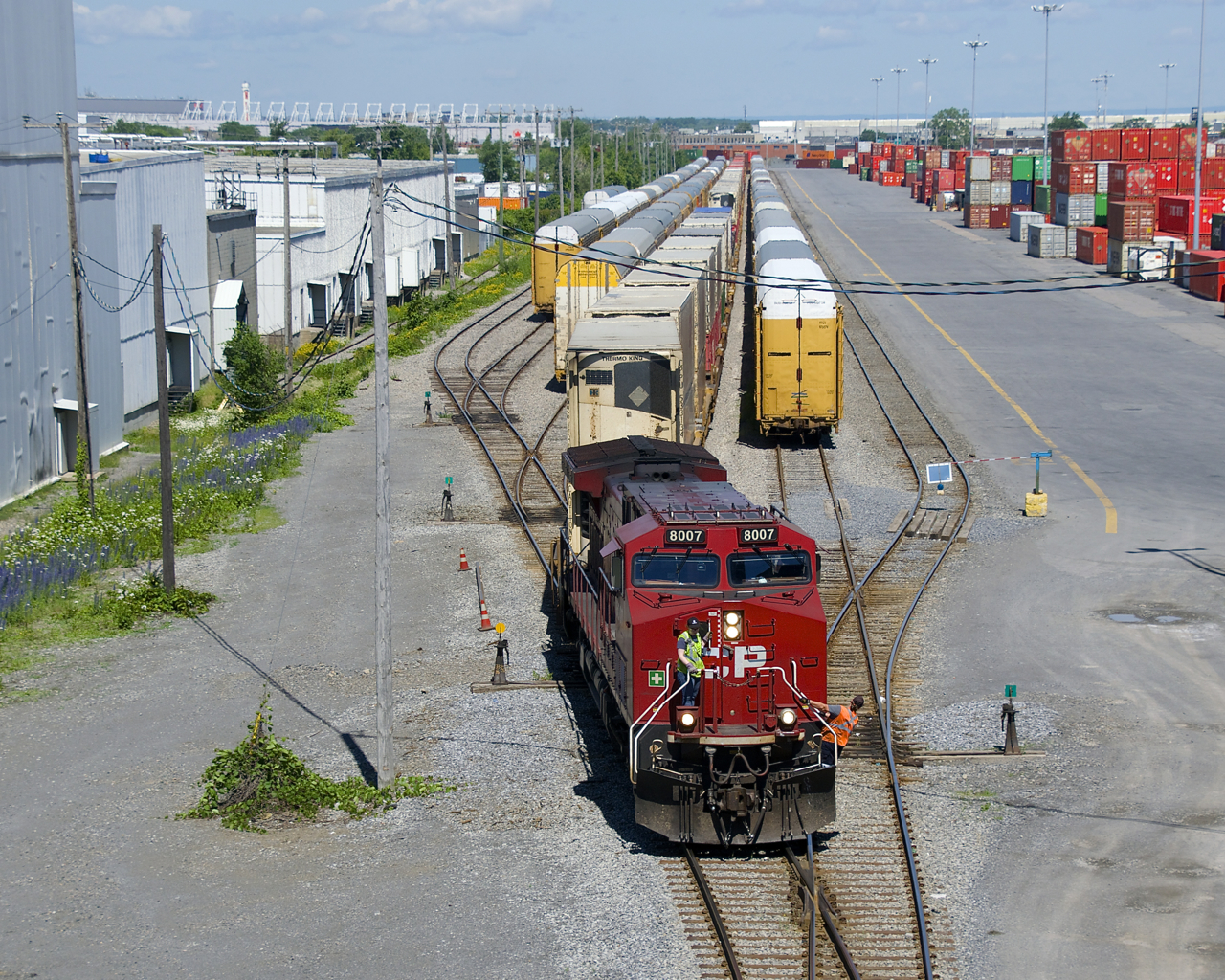 CP 112 is arriving in Lachine IMS as it passes tracks full of stored autoracks.