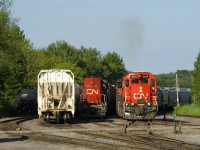 A bit of smoke pops up as CN 536's power starts to move. Beside it is CN 9411.