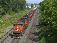 CN 527 has five units (CN 5656, CN 8815, CN 2901, CN 2906 & CN 8840) and 88 cars as it approaches Taschereau Yard.