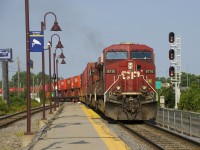 CP 119 is exiting Lachine IMS Yard with a long string of intermodal cars before backing up to the rest of its train.