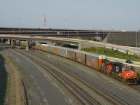 A short edition of CN 401 is powered by ES44DC CN 2235 and GP9 CN 4134 as its head west on the north track of the Montreal Sub, its journey from Joffre Yard nearly over.