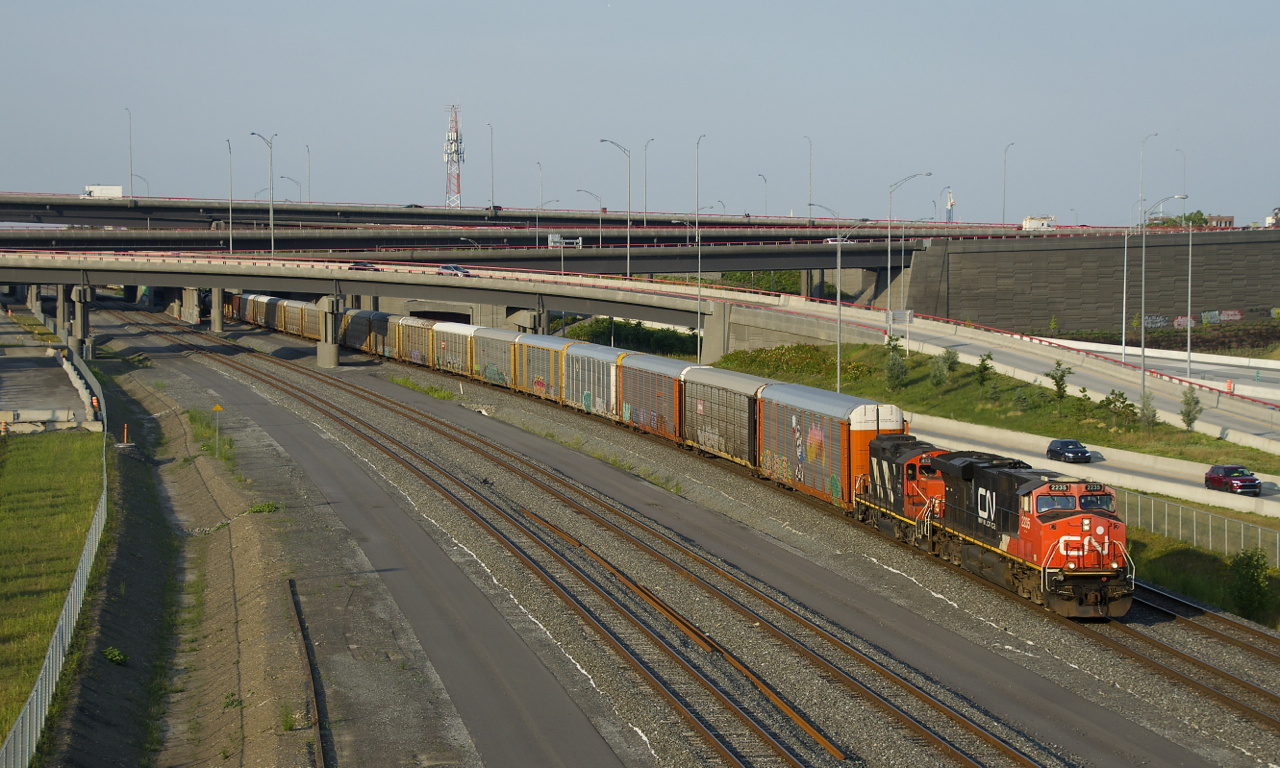 A short edition of CN 401 is powered by ES44DC CN 2235 and GP9 CN 4134 as its head west on the north track of the Montreal Sub, its journey from Joffre Yard nearly over.