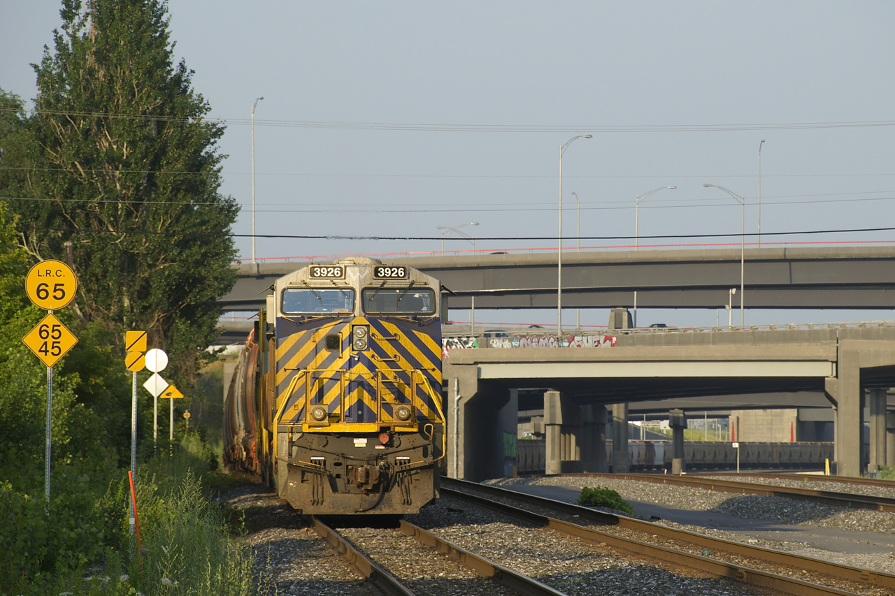 Potash train CN B730 is crewless and parked on the south track of the Montreal Sub after arriving there overnight. Leading is CN 3926, still in Citirail paint (it was originally CREX 1424). Out of sight behind it is another ex-CREX unit, CN 3924 (originally CREX 1421). CN has recently put a number of these units into service before being repainted.